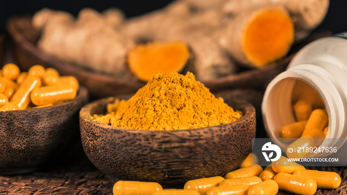 Curcumin Herbal Supplement Capsules and Turmeric Powder