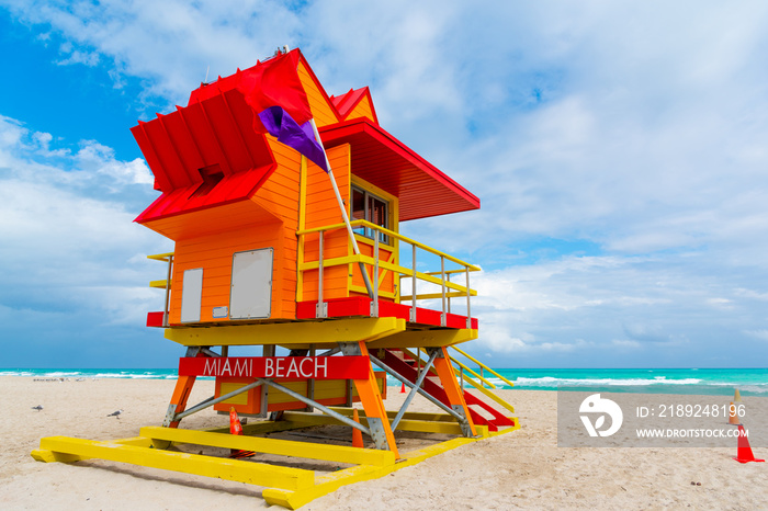 Orange, red and yellow lifeguard tower in world famous Miami Beach