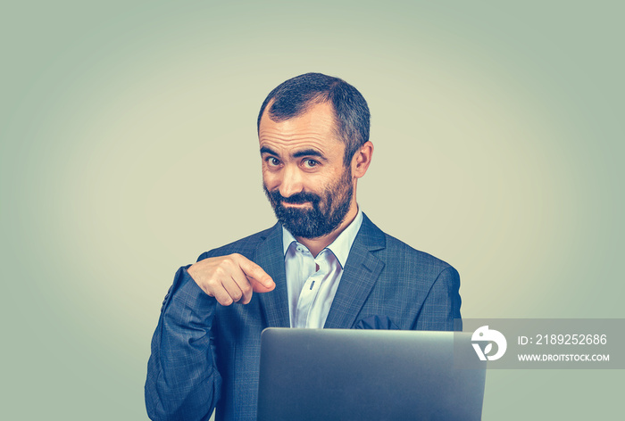 man showing pointing at you and laptop