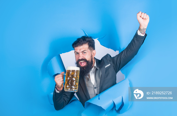 Oktoberfest. Drinks, alcohol, leisure, people concept. Bearded man holds mug of beer. Man drinks bee