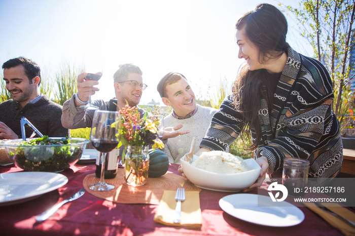 Group of friends enjoying party in garden