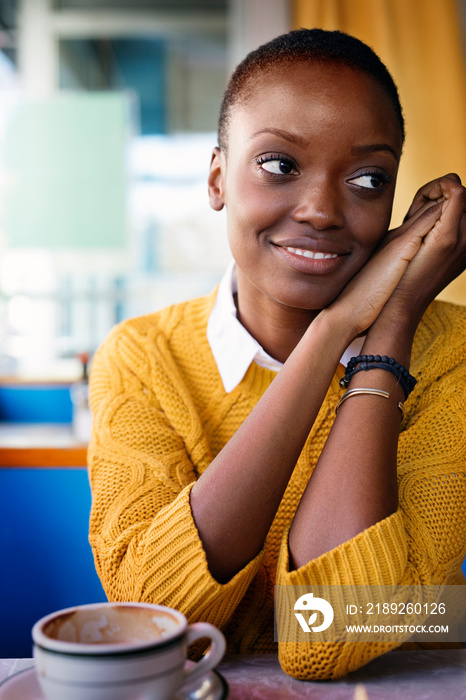 Young woman sitting in cafe