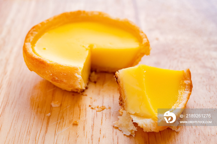 fresh egg tart with a quarter cut out close up