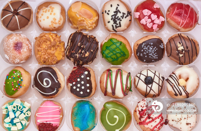 Rows of tasty doughnuts in a box