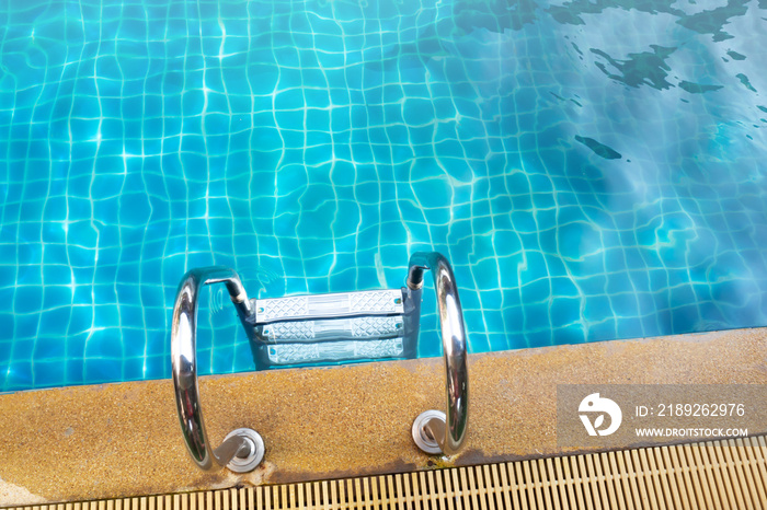 Stainless rail in swimming pool. Water activity.