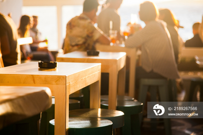 sunset bar by the beach - focus on table