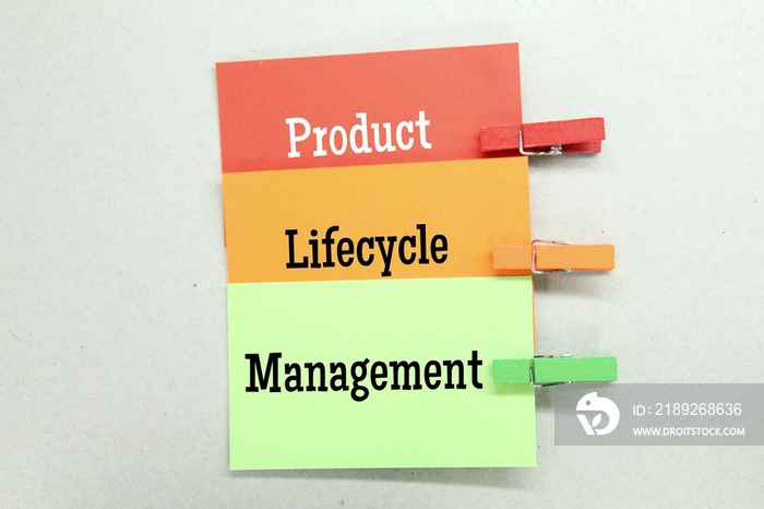 colored paper clamped with three words Product Lifecycle Management