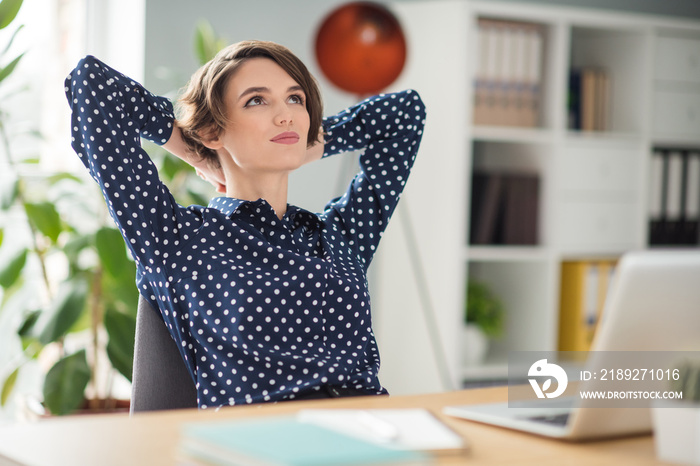 Portrait of attractive dreamy minded smart girl expert specialist sitting in chair resting in work p