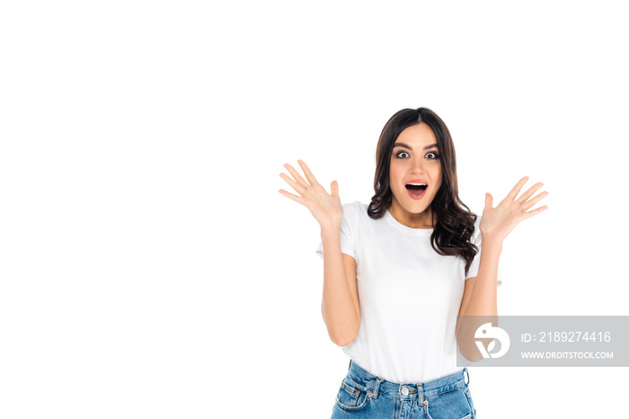 astonished woman in t-shirt showing wow gesture isolated on white.