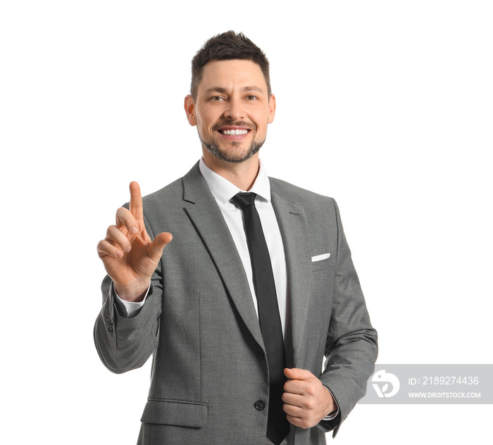 Businessman using virtual screen on white background