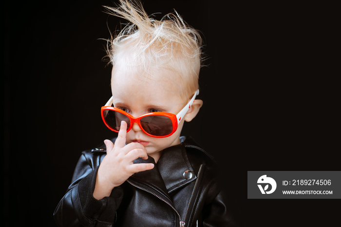 Rock music is a lifestyle. Little child boy in rocker jacket and sunglasses. Rock style child. Rock 