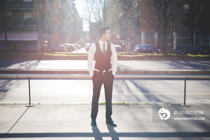 Young businessman in the street, Milan, Italy