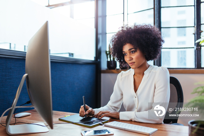 Female designer working in office