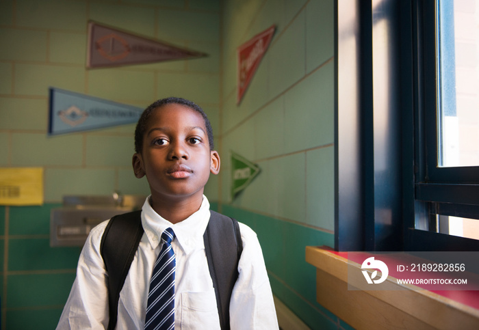 Portrait of student standing in school