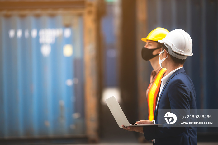 Foreman engineer working in container yard, Quality control Inspector using laptop for checking on c