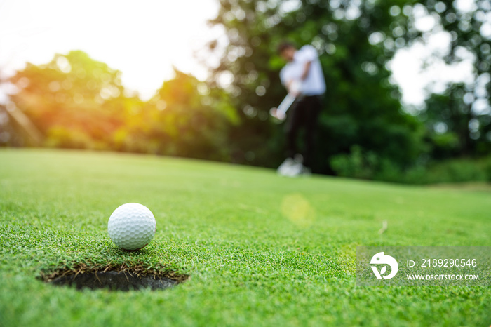 Close up golf ball on green grass field