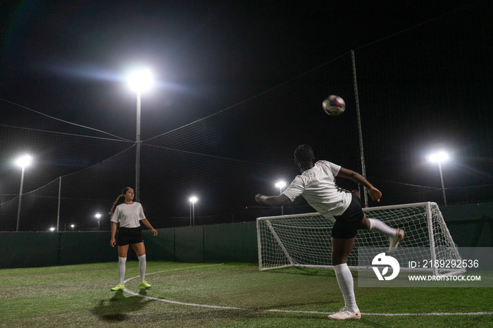 Female soccer players practicing