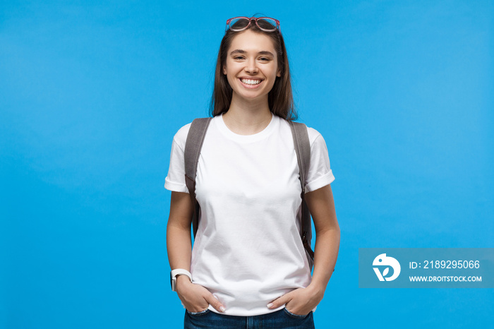 European hipster girl with backpack ready to study or travel, isolated on background