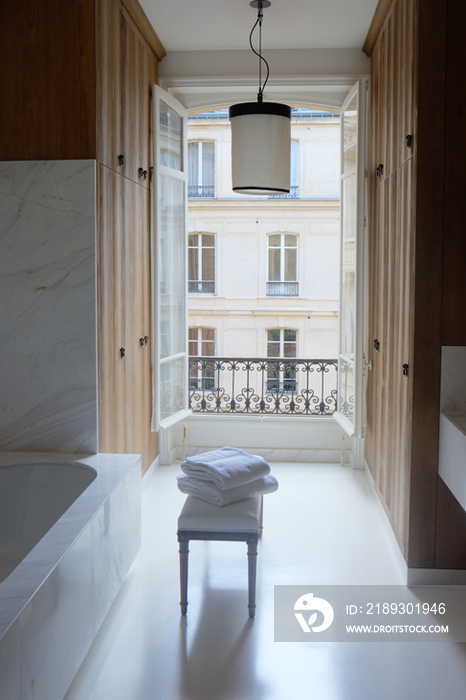 Bathtub and cabinets in bathroom