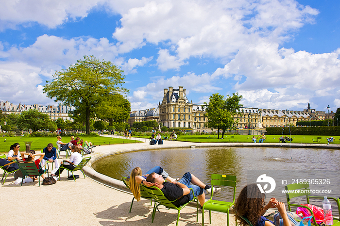 People relaxing at Tuileries Garden in Paris, France