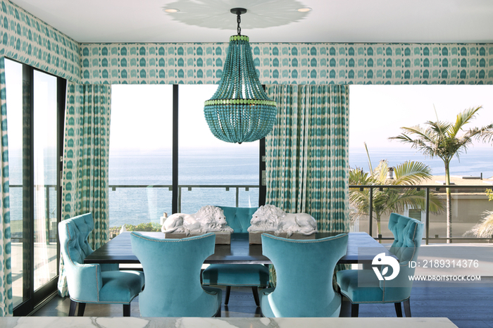 Blue accent dining area with ocean view; California; United States of America