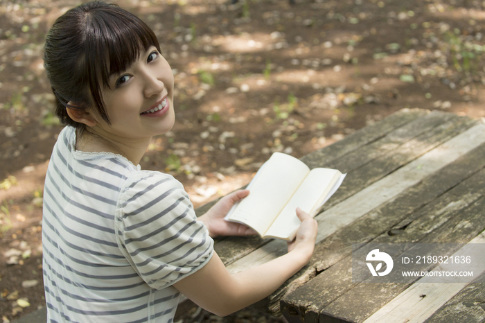 Young woman reading a book