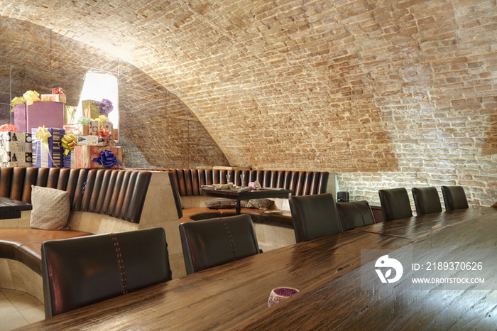 Long wooden table in sports bar