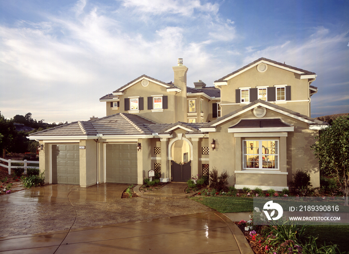 two story house with garages