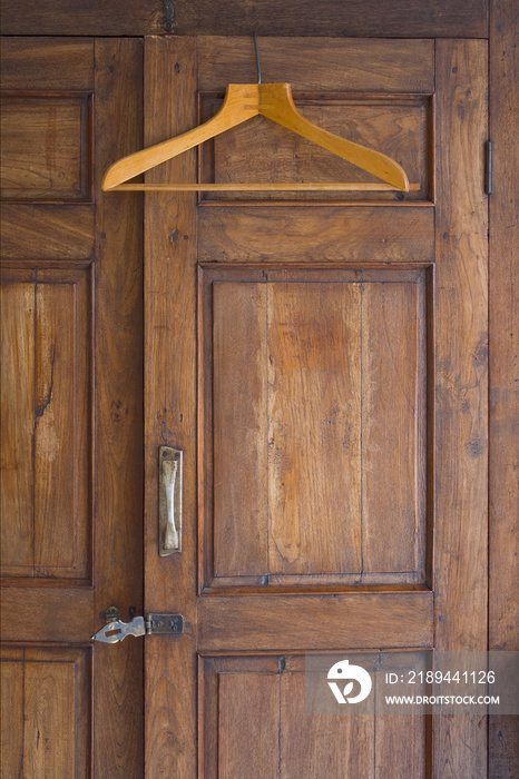 Wooden Hanger On Antique Closet