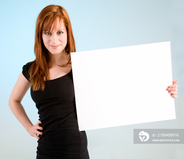 Young Redhead Woman Holding a Blank White Sign