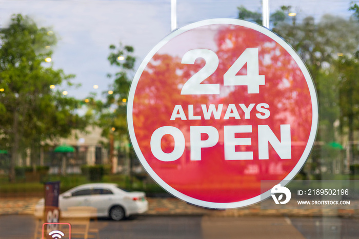 24 Hours Always Open Sign in front of the coffee shop cafe or co-working space in the town. 24 Hours