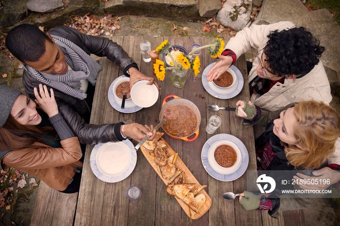 Friends having dinner outdoors