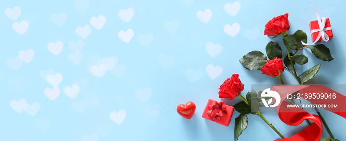 Beautiful roses and presents for Valentine day on blue background with space for text