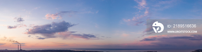 panorama of a bright dramatic twilight sky, beautiful clouds at dawn