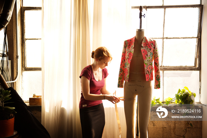 Female tailor working in workshop