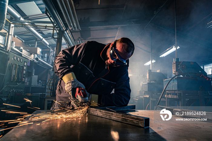 The handyman grinding in his workshop