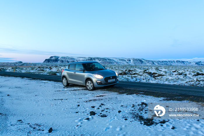 Suzuki swift car on a winter snowy road