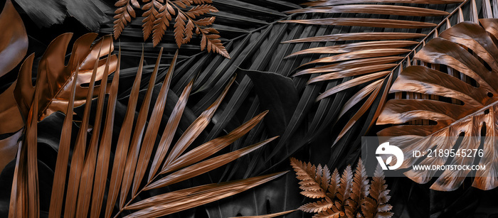 Creative nature background. Gold and green tropical Monstera and palm leaves. Minimal summer abstrac