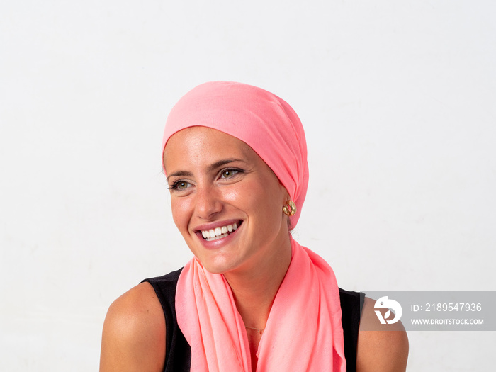 Young girl with pink handkerchief on her head