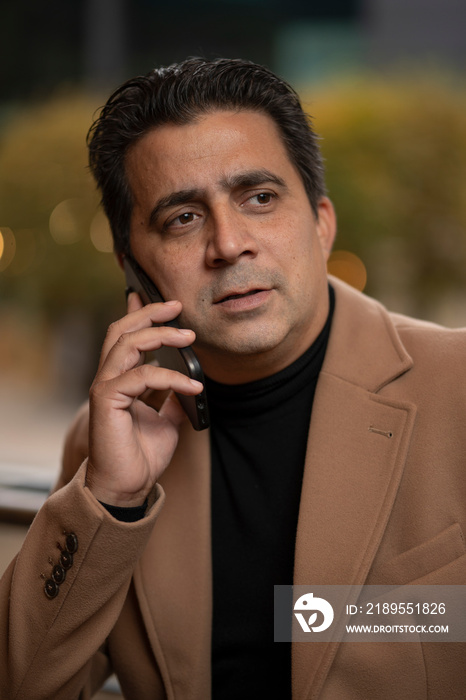 Mature man talking on phone