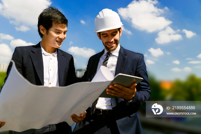 Two real estate developers exploring the project site.