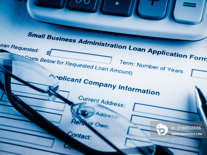 small business loan application on the desk.