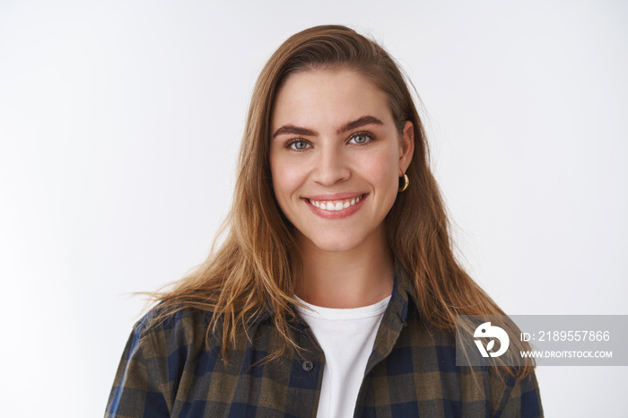 Close-up friendly-looking happy positive lucky young female wearing checked shirt over t-shirt smili