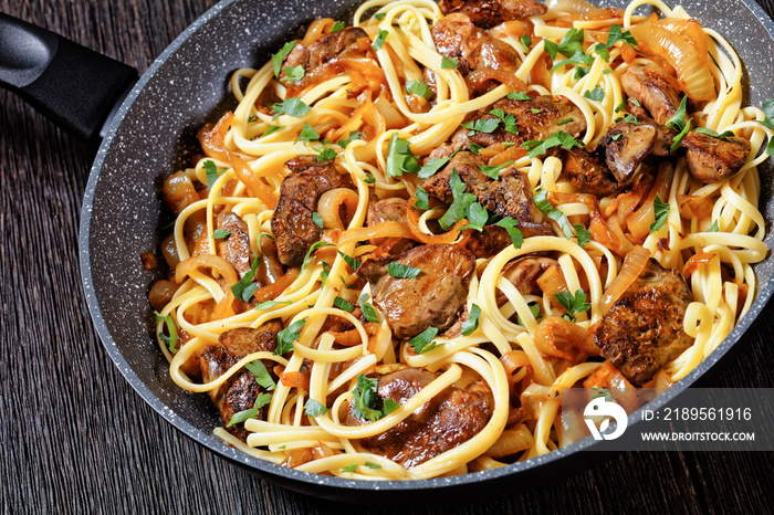 pasta linguine with fried chicken liver, top view