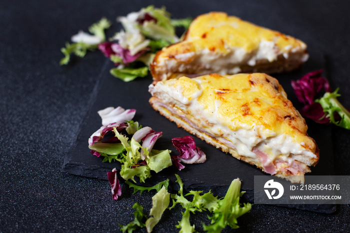 Sandwich with ham, cheese and bechamel sauce. A traditional french croque-monsieur sandwich served w