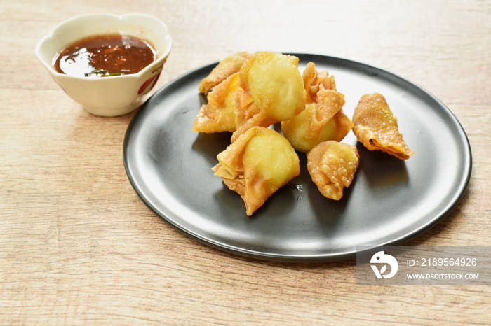 fried crispy Chinese dumpling paste wrapped egg quail dipping sweet and spicy sauce