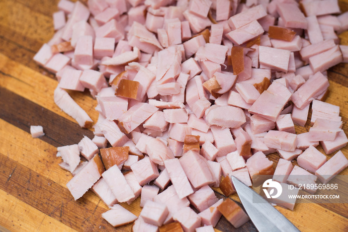 closeup of ham cubes on wooden background