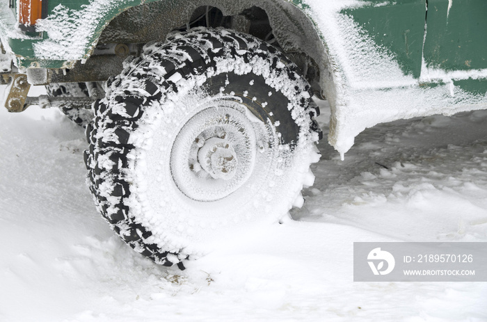 Jeeps tire in snow in winter