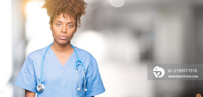 Young african american doctor woman over isolated background Relaxed with serious expression on face