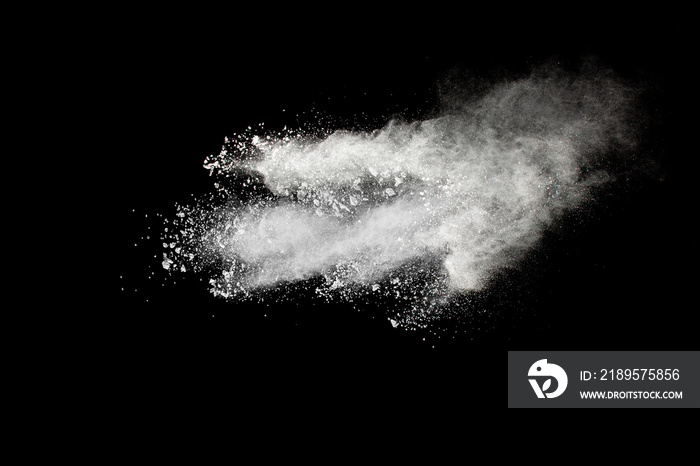 White powder explosion cloud against black background.White dust particles splash.